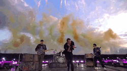 Coldplay At Brit Awards With Smoke Above Them GIF