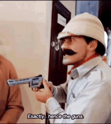 Colonel Mark Holding A Gun GIF