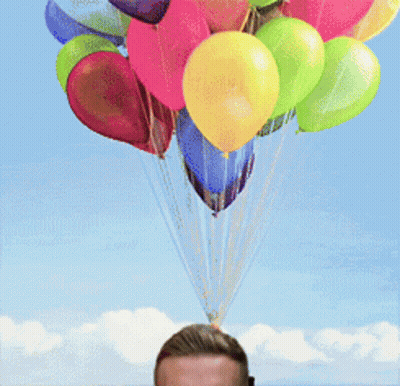 Colorful Balloons Hanging Over Man's Head GIF