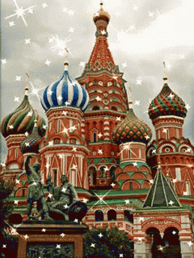 Colorful Building With Statue Saying Tatian GIF
