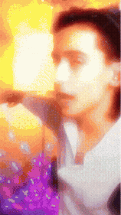 Colorful Man Holding Book GIF