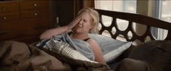 Comedian Amy Schumer Having Headache In Bed GIF