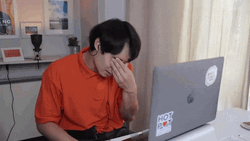 Comedian Nigel Ng Having Headache Touch His Nose GIF