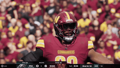 Commanders Football Player Standing In Front Of Crowd GIF