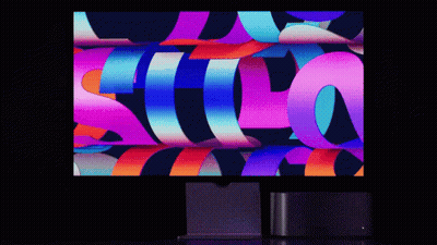 Computer Monitor Displaying Colorful Image With Letter S GIF