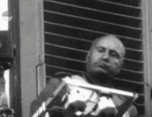 Confident Benito Mussolini Crossing Arms