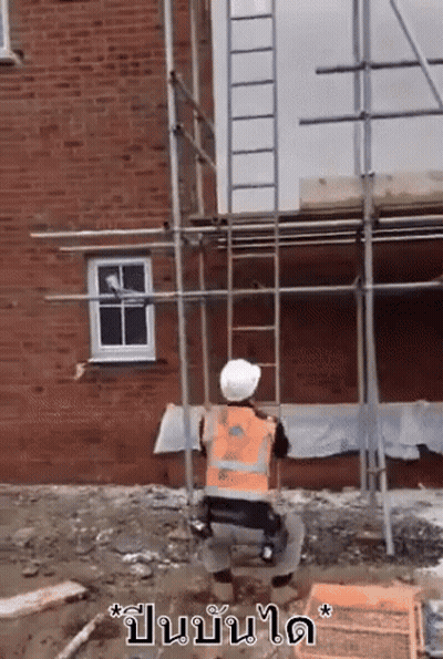 Construction Worker Kneeling In Orange Vest And Hard Hat GIF