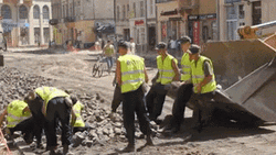 Construction Workers Tossing Rocks GIF