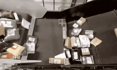 Conveyor Belt Filled With DHL Packages GIF