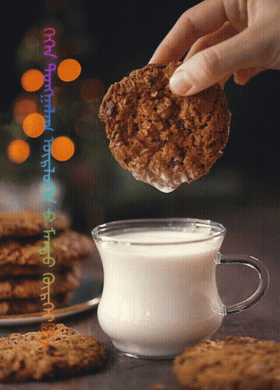 Cookie Dipped Into Glass Of Milk GIF