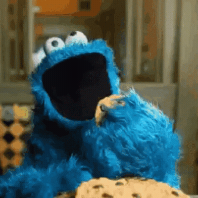 Cookie Monster Eating A Cookie With His Mouth Open GIF