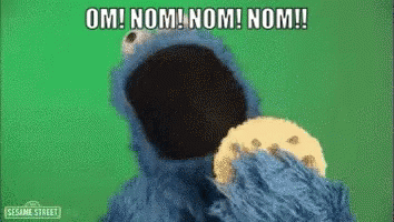 Cookie Monster From Sesame Street Is Eating A Cookie And Saying Om Nom Nom Nom ! GIF