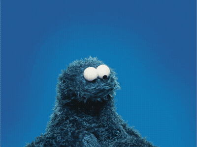 Cookie Monster Holding A Red Heart In Front Of His Face GIF