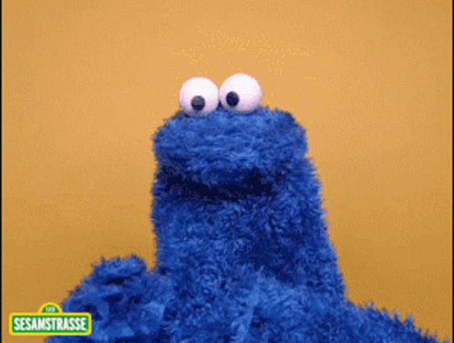 Cookie Monster On Yellow Background GIF