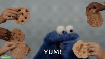 Cookie Monster Surrounded By People Holding Cookies GIF