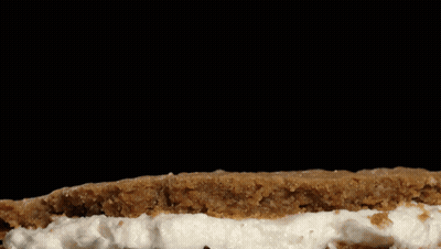 Cookie With Whipped Cream On Black Background GIF