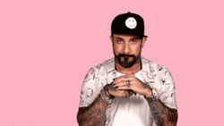 Cool Tattoed Guy Wearing Cap Birdman Hand Rub GIF