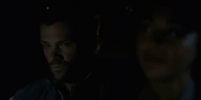 Cordell Walker Texas Ranger Is Talking To A Woman In A Dark Room . GIF