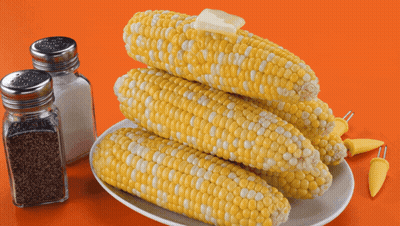 Corn On The Cob With Butter On Top Of It GIF