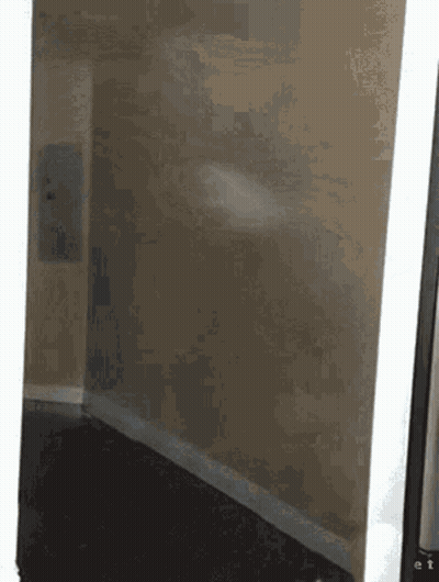 Corner Of Room With White Wall And Black Floor GIF