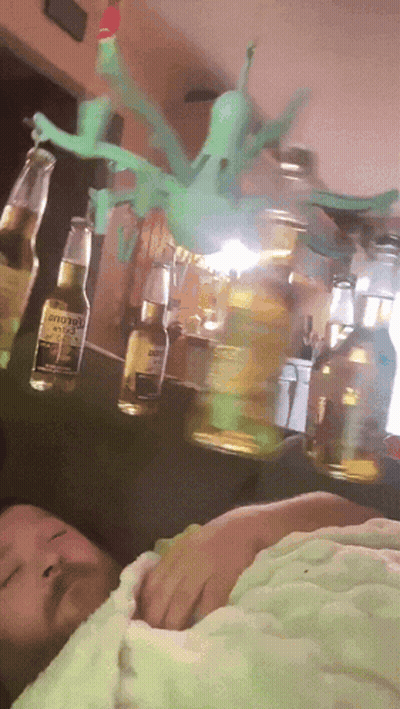 Corona Beer Bottle Hanging From Ceiling GIF