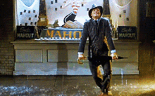 Cosmo Brown With His Umbrella Dancing In The Rain  GIF