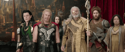 Costumed Group Standing Together GIF
