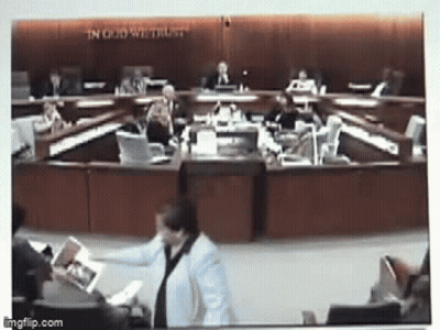 Council Meeting With In God We Trust Behind Them GIF