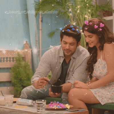 Couple At Table With Heart Of Sidharth Shakila GIF