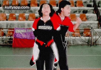Couple Dancing In Stadium With Enroll Sign GIF