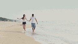 Couple Hold Hands Beach