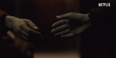 Couple Holding Hands With Netflix Logo GIF