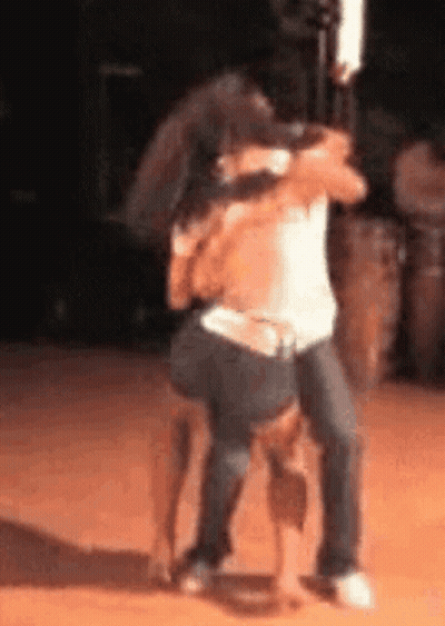 Couple Hugging On Stage GIF