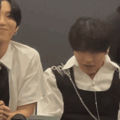 Couple In Black Vests, Man In White Shirt GIF