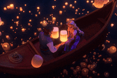 Couple In Boat Surrounded By Floating Lanterns GIF