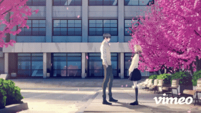 Couple in Front of Building with Vimeo Logo