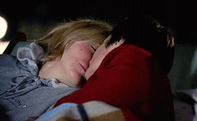 Couple Kissing In Car At Night Wearing City Sweatshirt GIF