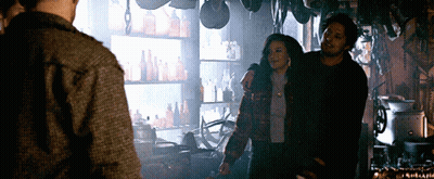 Couple Looking At Each Other In Dark Room GIF