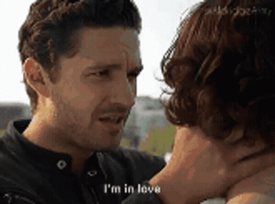Couple Looking, Man Saying I'm In Love GIF