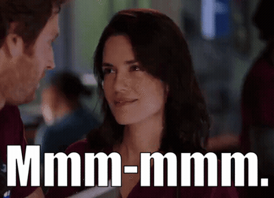 Couple Looking, Smiling Woman, Man Says Mmmm-Mmm GIF