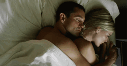 Couple Lying Together And Snuggling GIF