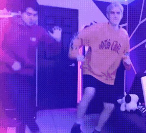 Couple Of Men Dancing In Purple Lights GIF