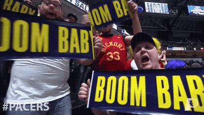 Couple Of Men Holding Signs Saying Boom Bab GIF