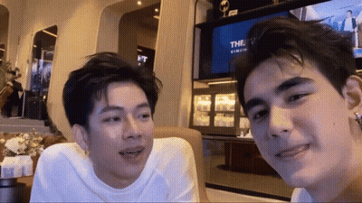 Couple Of Men Sitting In Front Of Television GIF