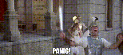 Couple Of People In Front Of Building With Panic GIF