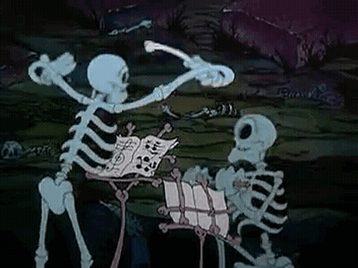 Couple Of Skeletons Standing In Dark Room GIF