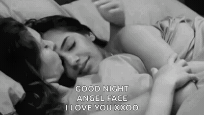 Couple Of Women Kissing On Bed GIF