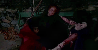 Couple Of Women Sitting On Bench At Night GIF