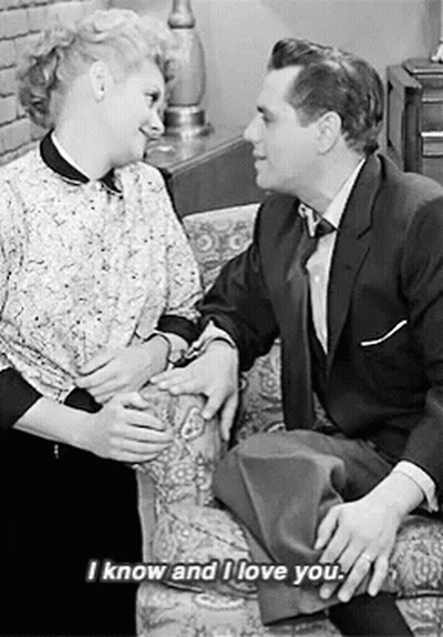 Couple On Couch Saying I Know And I Love You GIF