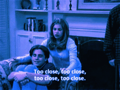Couple On Couch Saying Too Close GIF